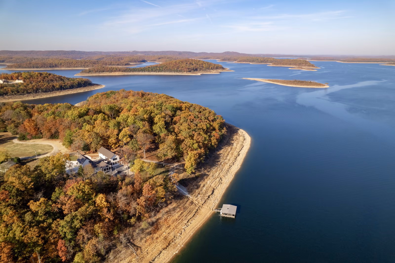 Aerial view of Walleye Point on a wooded point of Bull Shoals Lake