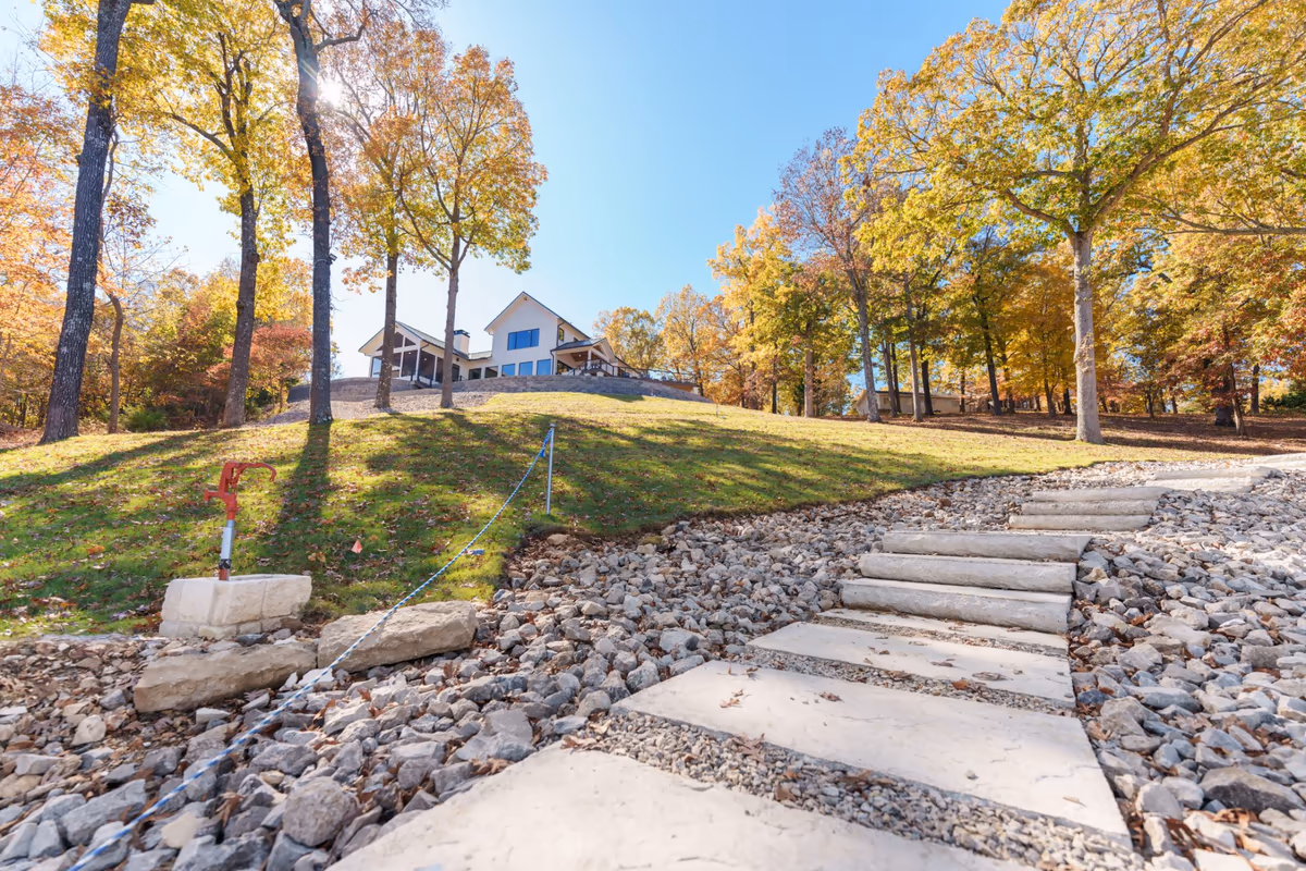 Stone path through autumn hardwoods on an Ozark hillside