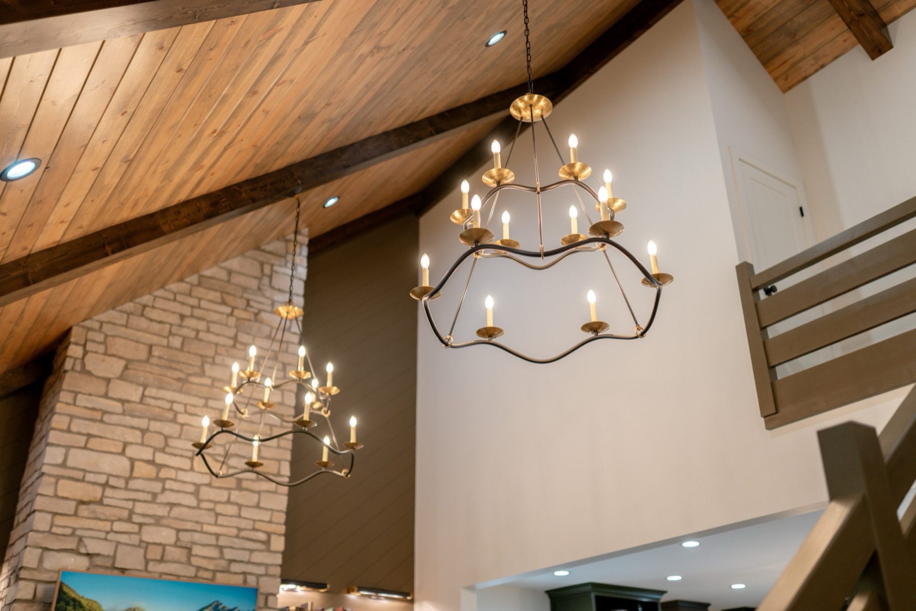 Designer chandeliers and stone wall detail — every finish considered