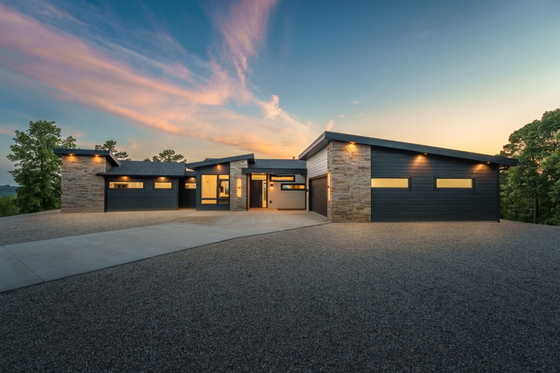 Modern custom home exterior at dusk — Crownover build